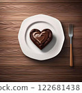 Heart-shaped chocolate cake and fork on white ceramic plate, wood grain background. AI generated image. 122681438