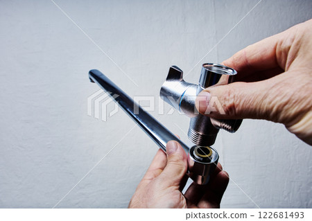 Installation of bathtub faucet with hand shower with mixer tap and long spout for wall mounted. Installation of bathtub faucet with hand shower with mixer tap and long spout for wall mounted. 122681493