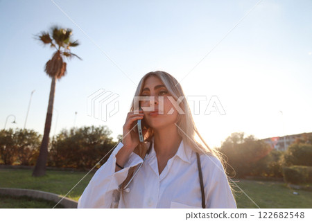 Focused Doctor Taking an Important Call Outdoors 122682548