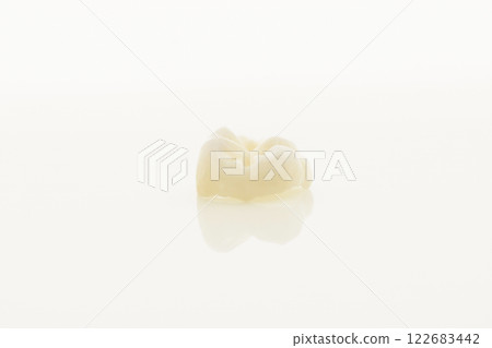 High-quality zirconia dental crown on white background. Dental ceramic crown professional dental lab High-quality zirconia dental crown on white background. Dental ceramic crown professional dental lab 122683442