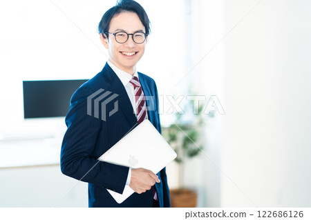 Smiling male businessman in a suit 122686126