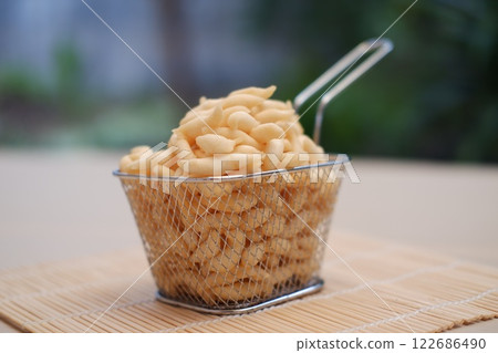 telur gabus sticks in a metal basket 122686490