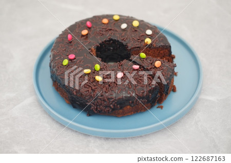 Chocolate cake on plate with marble background 122687163