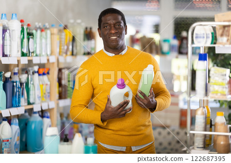 Male consumer with household chemical products for washing indoors 122687395