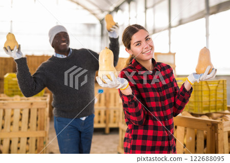 Funny farmers posing with pumpkins Funny farmers posing with pumpkins 122688095