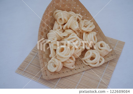 Fresh made Prawn Crackers  on bamboo mat 122689084