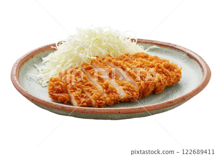 plate of tonkatsu with shredded cabbage, isolated background 122689411