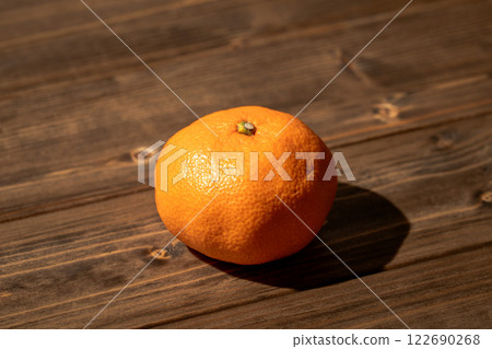 oranges placed on a wooden board oranges placed on a wooden board 122690268