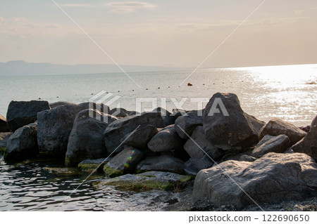 Sandy beach. Seaside vacation, golden beaches. Blue waters of the sea. Lake, ocean, sea 122690650