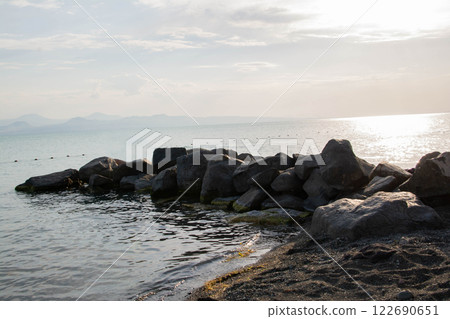 Sandy beach. Seaside vacation, golden beaches. Blue waters of the sea. Lake, ocean, sea 122690651