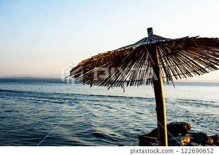 Sandy beach. Seaside vacation, golden beaches. Blue waters of the sea. Lake, ocean, sea 122690652