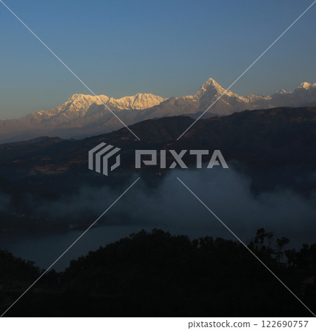 Annapurna South and Machapuchare seen from a place above Begnas Tal, Nepal. 122690757