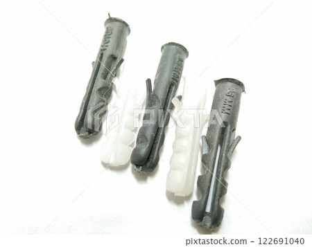 A picture of plastic screws isolated on white background 122691040