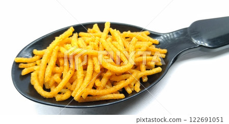 A picture of aloo bhujia isolated on a white background A picture of aloo bhujia isolated on a white background 122691051