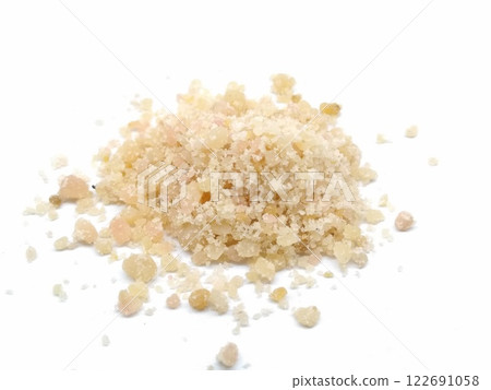 A picture of asafoetida powder isolated on a white background 122691058