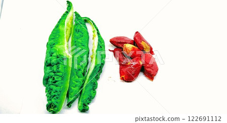 A picture of Bitter gourd seed's on white background A picture of Bitter gourd seed's on white background 122691112