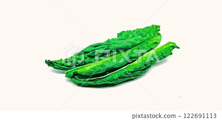 A picture of Bitter melon slices isolated on white background A picture of Bitter melon slices isolated on white background 122691113