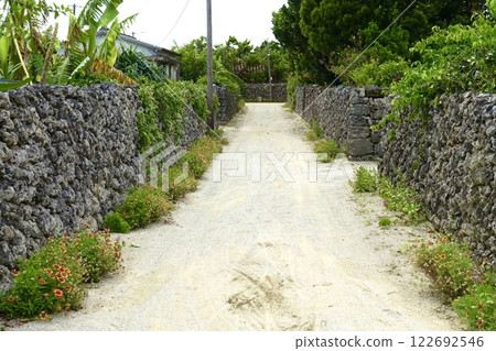 Stone walled alley on Taketomi Island. Okinawa scenery. 122692546