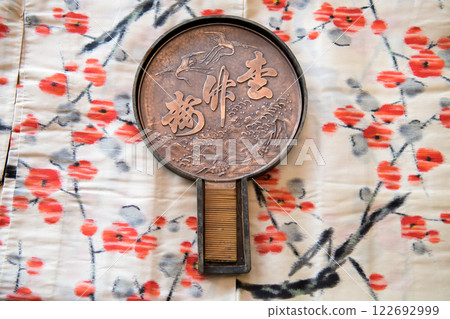 Kimono and antique copper mirror 122692999
