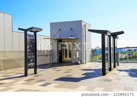 An outdoor elevator going up and down between the 1st floor parking lot and the 2nd floor corridor at Haneda Innovation City An outdoor elevator going up and down between the 1st floor parking lot and the 2nd floor corridor at Haneda Innovation City 122693173