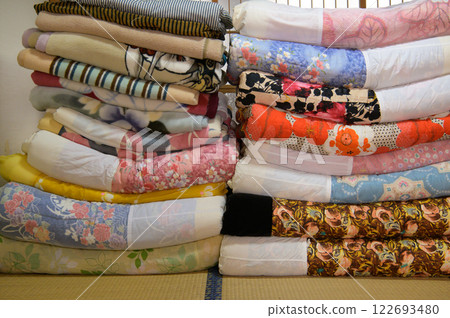 Stacks of futons and blankets 122693480