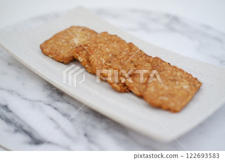 Fried tempeh is a popular Indonesian dish made from tempeh Fried tempeh is a popular Indonesian dish made from tempeh 122693583