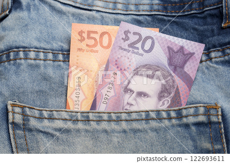 Barbadian dollar in the pocket of blue jeans 122693611