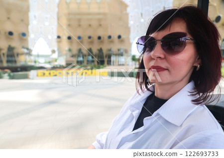 A tourist drives past the iconic Expo City Dubai, a vibrant spirit of innovation and culture at one of the world's most famous exhibitions A tourist drives past the iconic Expo City Dubai, a vibrant spirit of innovation and culture at one of the world's most famous exhibitions 122693733