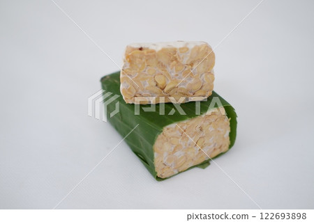 Tempeh is a traditional Indonesian food made from soybeans fermented with the Rhizopus oligosporus fungus Tempeh is a traditional Indonesian food made from soybeans fermented with the Rhizopus oligosporus fungus 122693898