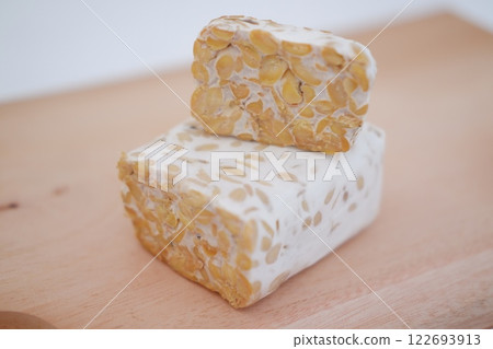 Tempeh is a traditional Indonesian food made from soybeans fermented with the Rhizopus oligosporus fungus Tempeh is a traditional Indonesian food made from soybeans fermented with the Rhizopus oligosporus fungus 122693913