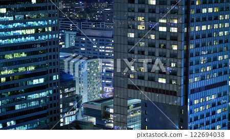 Aerial photography of modern architectural landscapes at night. Lights in the windows of buildings. The blue color of twilight. Aerial photography of modern architectural landscapes at night. Lights in the windows of buildings. The blue color of twilight. 122694038