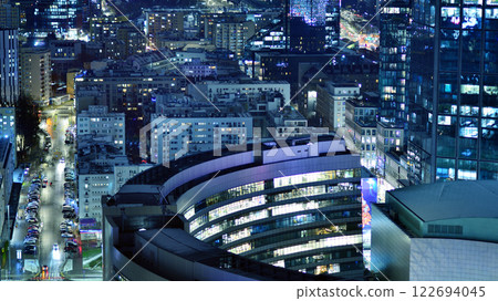 Aerial photography of modern architectural landscapes at night. Lights in the windows of buildings. The blue color of twilight. Aerial photography of modern architectural landscapes at night. Lights in the windows of buildings. The blue color of twilight. 122694045
