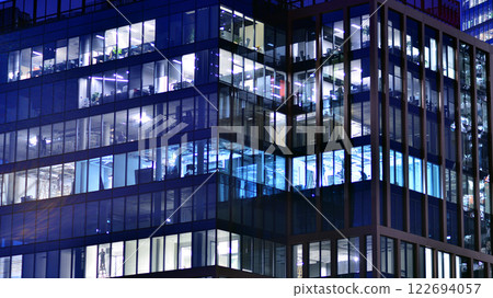 Aerial photography of modern architectural landscapes at night. Lights in the windows of buildings. The blue color of twilight. Aerial photography of modern architectural landscapes at night. Lights in the windows of buildings. The blue color of twilight. 122694057