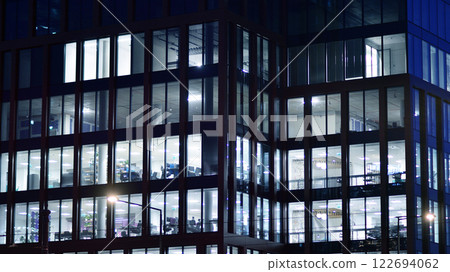 Aerial photography of modern architectural landscapes at night. Lights in the windows of buildings. The blue color of twilight. Aerial photography of modern architectural landscapes at night. Lights in the windows of buildings. The blue color of twilight. 122694062