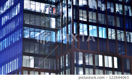 Aerial photography of modern architectural landscapes at night. Lights in the windows of buildings. The blue color of twilight. 122694063