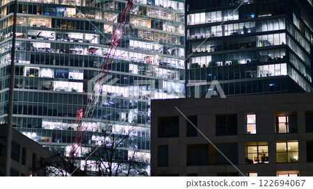 Aerial photography of modern architectural landscapes at night. Lights in the windows of buildings. The blue color of twilight. Aerial photography of modern architectural landscapes at night. Lights in the windows of buildings. The blue color of twilight. 122694067