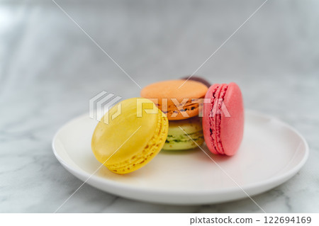 Colorful macaroons on a white plate 122694169