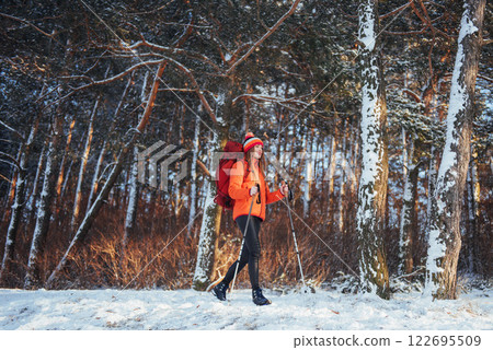 Woman Traveler with backpack hiking Travel Lifestyle adventure concept active vacations outdoor. Beautiful landscape forest 122695509