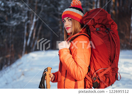 Woman Traveler with backpack hiking Travel Lifestyle adventure concept active vacations outdoor. Beautiful landscape forest 122695512