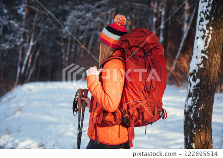 Woman Traveler with backpack hiking Travel Lifestyle adventure concept active vacations outdoor. Beautiful landscape forest 122695514