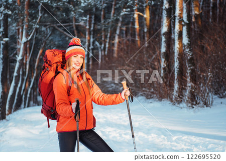 Woman Traveler with backpack hiking Travel Lifestyle adventure concept active vacations outdoor. Beautiful landscape forest Woman Traveler with backpack hiking Travel Lifestyle adventure concept active vacations outdoor. Beautiful landscape forest 122695520