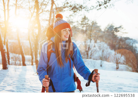 Woman Traveler with backpack hiking Travel Lifestyle adventure concept active vacations outdoor. Beautiful landscape forest 122695538
