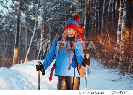 Woman Traveler with backpack hiking Travel Lifestyle adventure concept active vacations outdoor. Beautiful landscape forest Woman Traveler with backpack hiking Travel Lifestyle adventure concept active vacations outdoor. Beautiful landscape forest 122695543