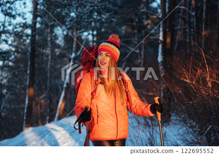 Woman Traveler with backpack hiking Travel Lifestyle adventure concept active vacations outdoor. Beautiful landscape forest Woman Traveler with backpack hiking Travel Lifestyle adventure concept active vacations outdoor. Beautiful landscape forest 122695552