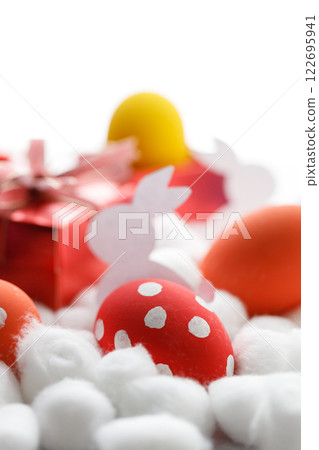 Happy Easter eggs and gift boxes on white background. Easter decoration. Happy Easter eggs and gift boxes on white background. Easter decoration. 122695941