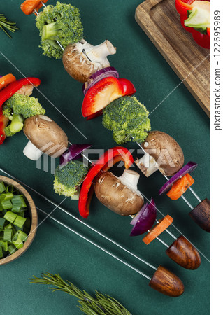 Appetizing uncooked vegetable shashlik or kebab. 122695989