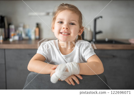 Little girl with broken finger at the doctor's appointment in the hospital Little girl with broken finger at the doctor's appointment in the hospital 122696071