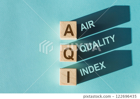 AQI Abbreviation of air quality index text on wooden cubes on blue background. 122696435