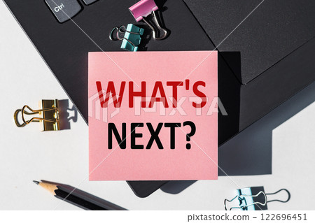 What's Next? Motivation answer on paper stickers on laptop. Business Concept 122696451
