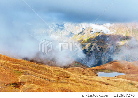 Majestic mountain landscape. Koruldi lakes and a tourist admiring the view. Active life concept 122697276